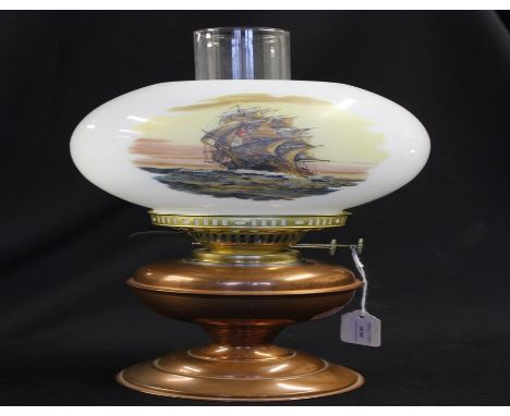 Brass oil lamp with a sailing ship pictured on the shade, 48cm high