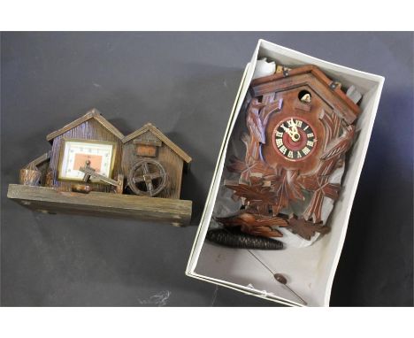 Cuckoo clock, made in Germany, together with a novelty mantle clock with water mill, (2)
