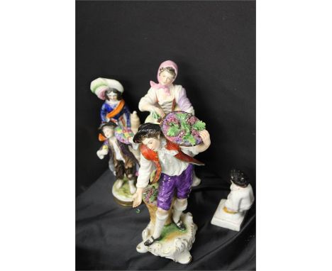 Two Staffordshire Potteries figures one of a man bearing his bottom, together with three other ceramic figures, (5)