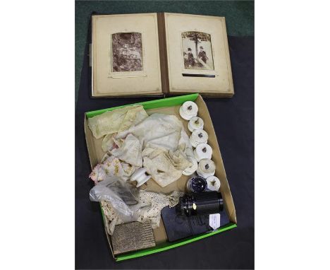 Mixed works of art to include a Victorian CDV album, silk handkerchiefs, ceramic door knobs, camera lenses, clock keys, etc, 