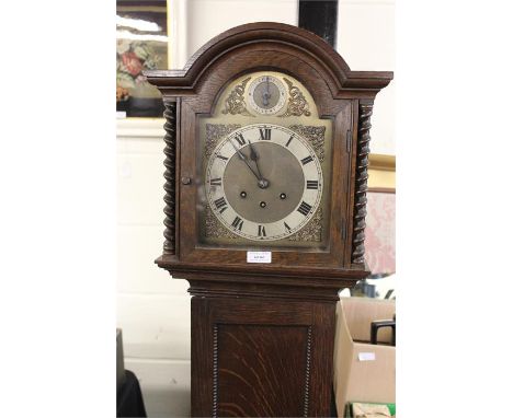 Oak cased longcase clock, of small proportions, with a circular dial and long trunk case