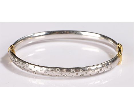 18 carat white gold and diamond set bracelet/bangle, set with fifty diamonds to the top half of the bangle, 41 grams