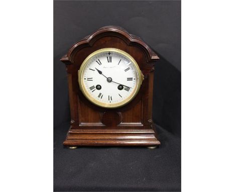 Mahogany cased mantel clock, with a white signed enamel dial, French movement