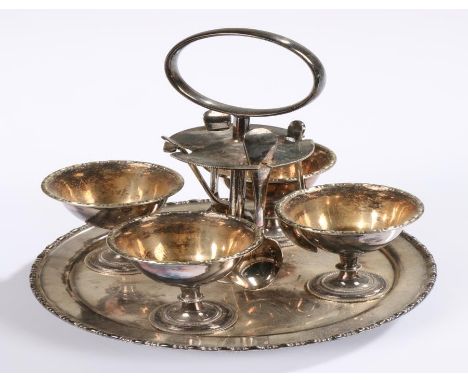 Silver plated egg cruet, with four cups, four spoons to the cruet stand