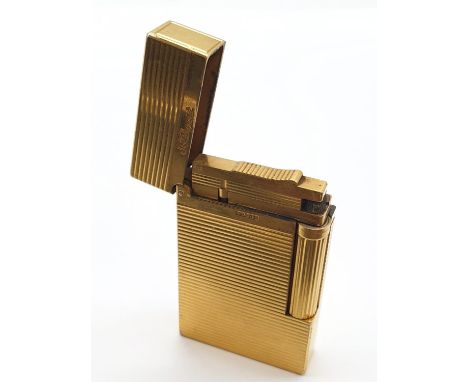 A vintage gold plated ST. Dupont lighter. Needs new flint and gas. 
