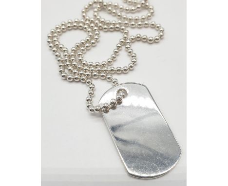 Sterling Silver dog tag on 49cm long silver chain, weight 16.5g approx 