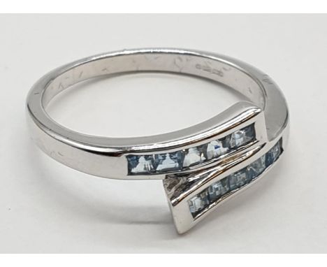 9ct gold ring with aquamarine stones. Size P. Weight 3.36 grams. 
