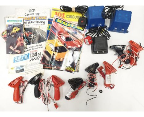 Box with five Scalextric controllers and three power units plus instructions and magazines A/F. 