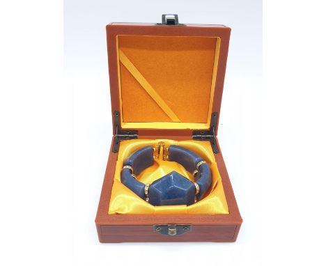 A chunky, bluish green, aventurine  jade and cubic zirconia  bracelet in a presentation box. Total weight: 92 g. 