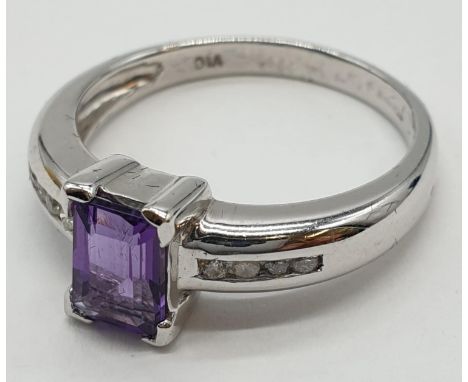 9ct white gold emerald cut amethyst and diamond ring. Size O. Weight 3.45 grams 