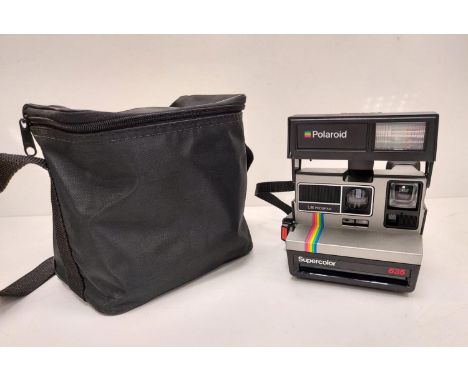 Polaroid Super-colour 635 camera, featuring iconic Polaroid rainbow stripe. Compatible with 600 type film. Comes with case an