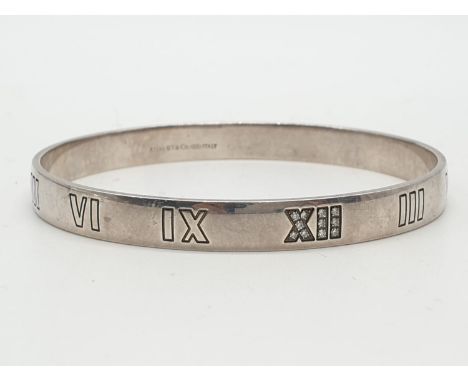 Tiffany silver and diamond bangle with Roman numerals, weight 21.6g and 63mm width. 