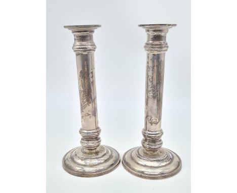 A Pair of Column Candle Stick. 925 Sliver. Weight:1.25kg. 20cm Height. 9cm Diameter at Base. 