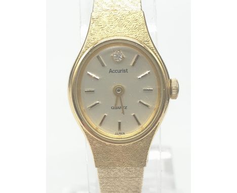 Vintage Accurist ladies 'gold' coloured wristwatch. Having original Accurist box and paperwork, complete with safety chain. Q