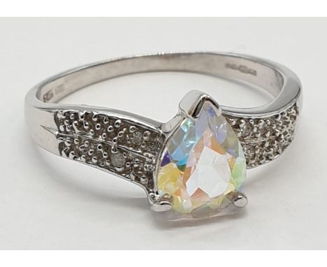 9ct white gold mystic topaz and diamond ring. Size M, Weight 2.24 grams. 