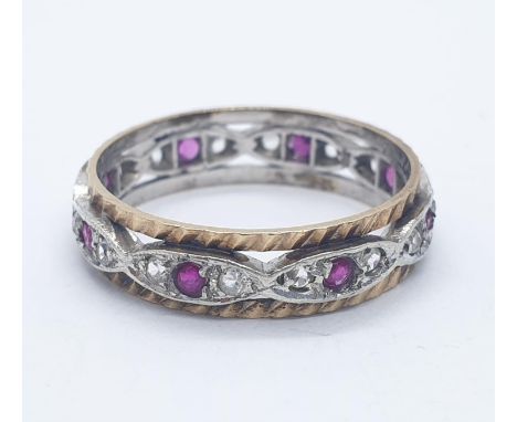 9ct ruby and white sapphire eternity ring. 2.6g in weight. Size O.