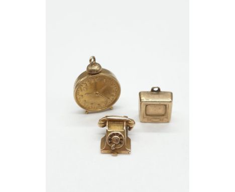 Three 9ct gold charms/pendants of an old fashioned telephone, tv and alarm clock. Size of Clock is 2cm, others are 1cm. Weigh