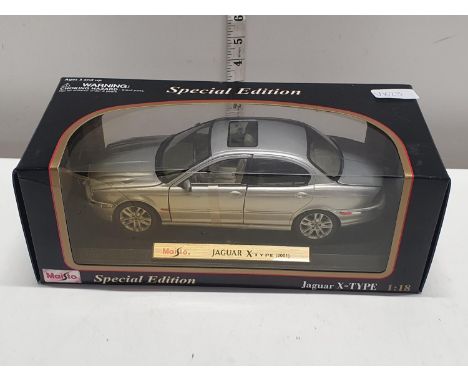 A boxed Maisto Jaguar X-type special edition die-cast model