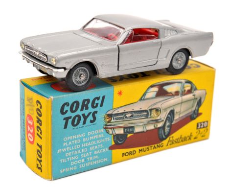 Corgi Toys Ford Mustang Fastback 2+2 (320). In metallic silver with red interior and detailed wheels. Boxed. Vehicle Mint. Pl