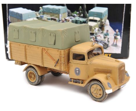 King & Country Afrika Korps “Opel Blitz Truck with driver” (AK 37). An example in desert sand livery, with light green remova