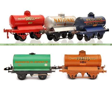 5 Hornby Series O gauge tank wagons. National Benzole Mixture in metallic silver, Redline Super Petrol in dark blue, Manchest