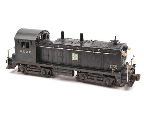 A Lionel O gauge 3-rail electric AT&SF Bo-Bo diesel locomotive. RN 6220 in unlined black livery with Santa Fe, Lionel and GM 