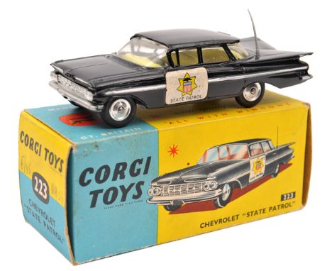 Corgi Toys Chevrolet “State Patrol” (223) In black with “State Patrol” stickers to doors and yellow interior and spun wheels.