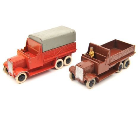 2 Dinky Toys Six Wheeled Transport Wagon (25S). A rare example in bright red and another in dark brown. Both with black smoot