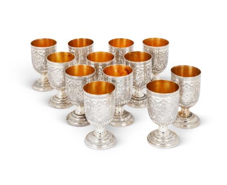 A SET OF TWELVE SILVER COLOURED CUPSUNMARKEDWith a lobed band, engraved with flowers, animals, birds and scroll decoration, o