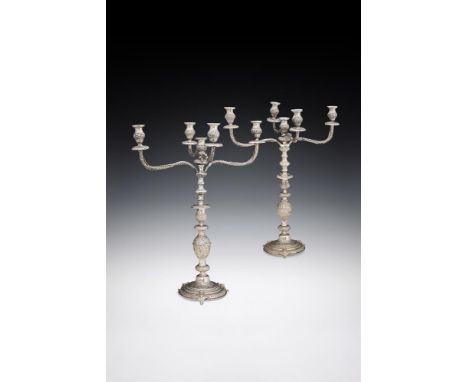 A PAIR OF VICTORIAN SILVER FIVE LIGHT CANDELABRAJACOB LANGLEBEN, LONDON 1897With circular sconces, baluster capitals, four fo