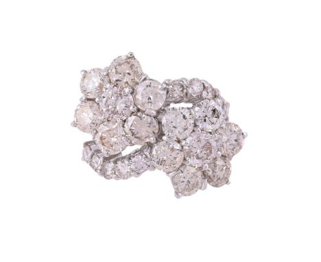 A DIAMOND DOUBLE CLUSTER RINGThe two brilliant cut diamond clusters to diamond set crossover shoulders, approximately 7.24 ca
