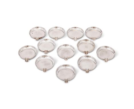 A SET OF TWELVE SILVER ASHTRAYS F. DRURY LTD., SHEFFIELD 1976 9cm (3 1/2in) long 1114g (35.8 oz)Provenance:  From the Private