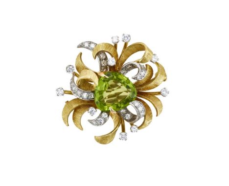 A MID 20TH CENTURY PERIDOT AND DIAMOND BROOCH The triangular mixed cut peridot within a two colour scrolling foliate surround