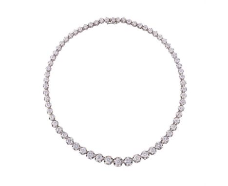 A DIAMOND RIVIÈRE NECKLACEThe collar of graduated brilliant cut diamonds in five claw settings, approximately 23.00 carats to