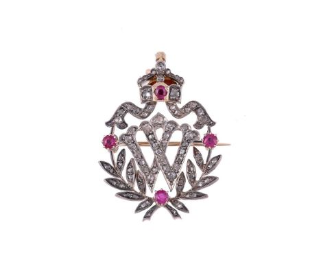 A RUBY AND DIAMOND 'W' BROOCH CIRCA 1910The brooch with a rose cut diamond W, with a rose cut laurel wreath below and coronet
