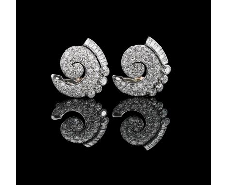 BOUCHERON, PARIS, A PAIR OF MID 20TH CENTURY DIAMOND SCROLLED CLIPSThe scrolled clips pavé set with various old European cut 