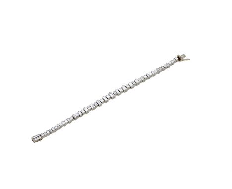 A DIAMOND LINE BRACELETThe bracelet with alternating square step cut and rectangular step cut diamonds, approximately 10.60 c