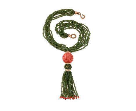 Y A FRENCH CORAL AND NEPHRITE BEAD NECKLACEThe multi strand nephrite necklace to a carved coral orb, with quatrefoil foliate 