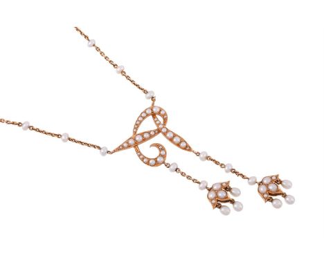 AN EDWARDIAN GOLD AND SEED PEARL NECKLACE CIRCA 1910The scrolled whiplash motif pendant set with graduated half pearls and se