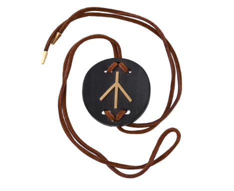 Y ATTRIBUTED TO RENÉ BOIVIN, A FRENCH 1980S EBONY AND GOLD COLOURED PENDANT NECKLACEThe circular bowed panel with a polished 