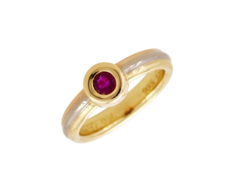 CARTIER, A RUBY AND THREE COLOUR RING CIRCA 1995The circular cut ruby within a rubover setting, to a three colour band, stamp