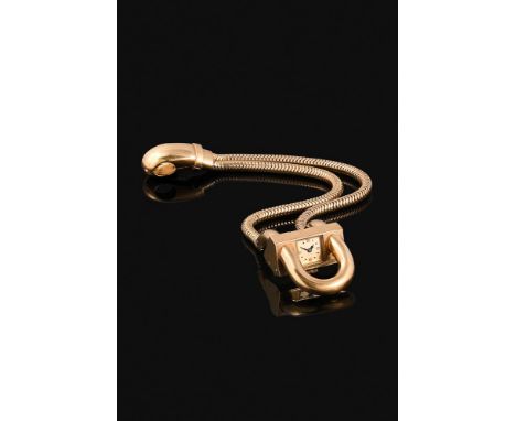 VAN CLEEF & ARPELS, CADENAS, A VINTAGE GOLD COLOURED BRACELET WATCHThe squared gold tone dial with dot hour markers and blued