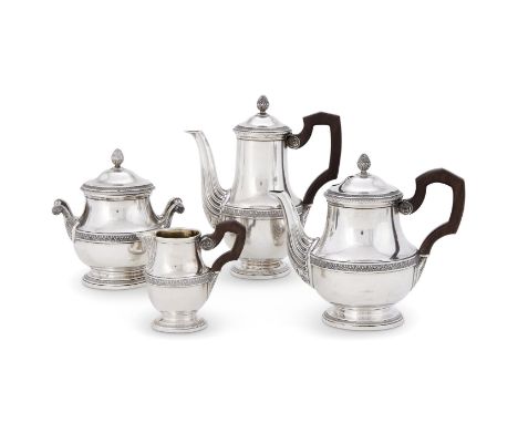 A FRENCH SILVER FOUR PIECE TEA SERVICEA. RISLER & CARRÉ, PARIS CIRCA 1900The tea pot with a wooden scroll handle, a cone fini