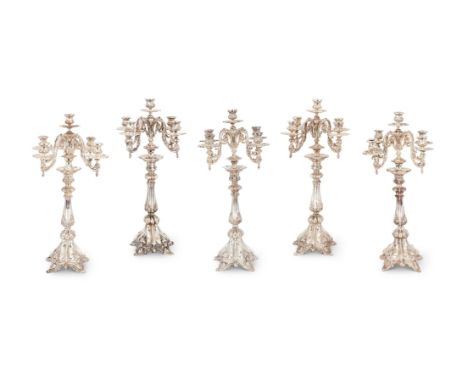 A SET OF FIVE EGYPTIAN SILVER COLOURED FIVE LIGHT CANDELABRA .900 STANDARD, CIRCA 1977 With flower embossed baluster capitals