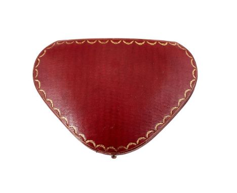 CARTIER, A GILT TOOLED RED LEATHER JEWEL CASE FIRST HALF OF THE 20TH CENTURYThe triangular shaped case with silk and velvet i