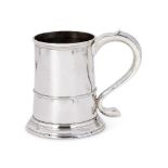 A GEORGE III SILVER TANKARD