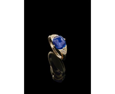 ASPREY & CO., A SAPPHIRE AND DIAMOND RING, KASHMIR, NO HEAT LONDON 1998The sugarloaf cabochon sapphire weighing 6.33 carats i