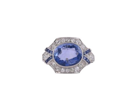 A DIAMOND AND SAPPHIRE DRESS RING, SRI LANKA (CEYLON), NO HEATThe central oval cut sapphire estimated to weigh 4.80 carats, w