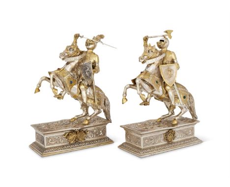 A PAIR OF SILVER AND SILVER GILT MODELS OF KNIGHTS ON HORSEBACKSPONSOR'S MARKS FOR GARRARD & CO. LTD AND ISRAEL FREEMAN & SON