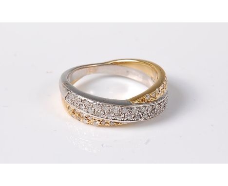 An 18ct bi-coloured gold and diamond crossover ring, the white and yellow gold bands, both half set with pave diamonds, total